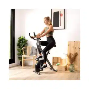Drumfit X-Bike 3000 Neo Bicicleta estática plegable. Pantalla LCD. Volante de inercia 3 Kg. Resistencia magnética variable. Sillín confort. Soporte para tablet y ruedas de transporte.